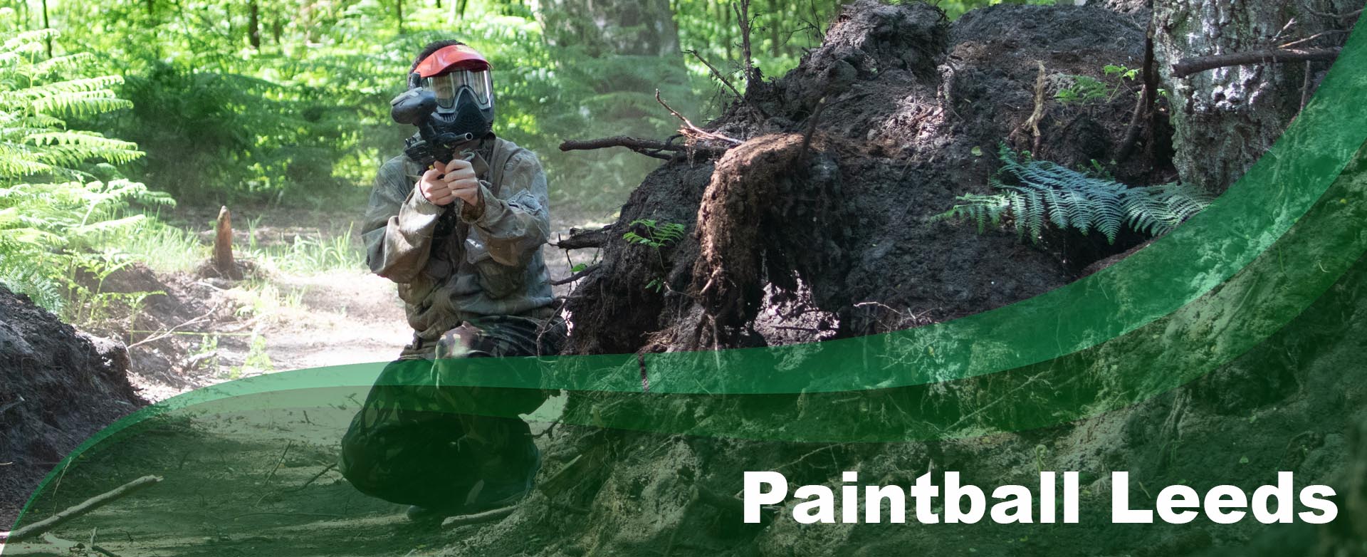 Player taking part in woodland paintball at Yorkshire Outdoor Activity Park near Leeds