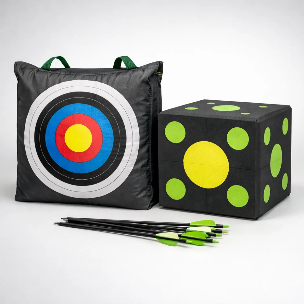 A bag archery target and a cube archery target shown side by side with arrows nearby